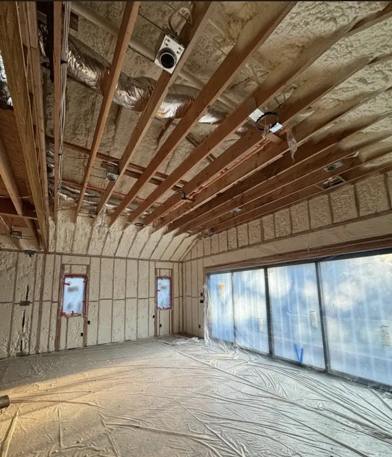 Interior walls and ceiling insulated with spray foam during new construction in Berkeley